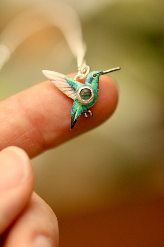 Hummingbird pendant with teal sapphire